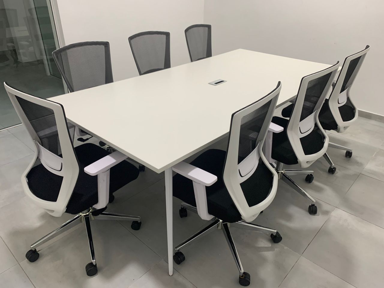 Modern office conference room furniture set with chairs and a large table, showcasing a sleek and professional design.